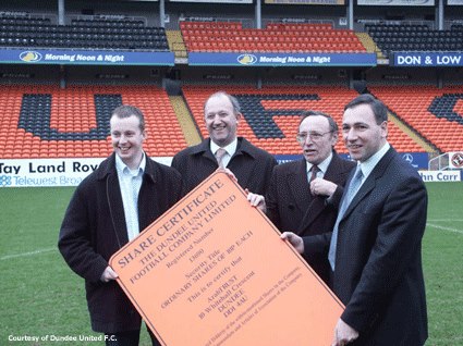 Dundee United Supporters’ Trust ‘ArabTRUST’ accepting a number of shares from United Chairman Eddie Thompson